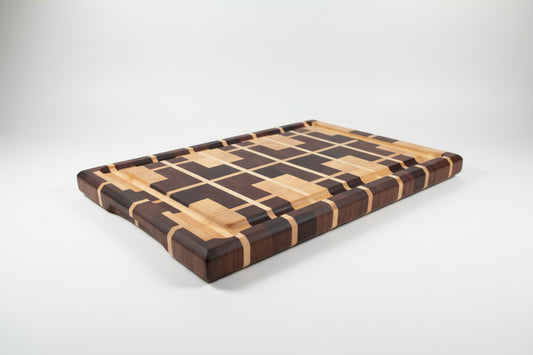 Wooden cutting board with geometric design on a wooden floor